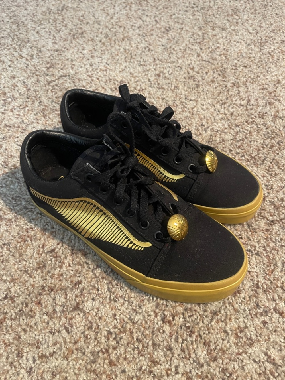 Vans Black and Gold Low-Top Skate Sneakers